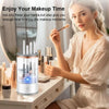 A woman is using an automatic electric makeup brush cleaner device on a vanity table.