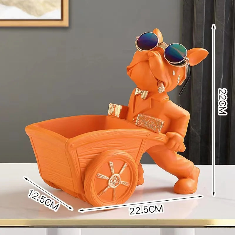 An orange French bulldog sculpture designed as a coin bank and snack holder sitting on a white surface.