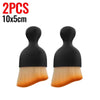 A pair of black multi-surface cleaning brushes with light yellow bristles.