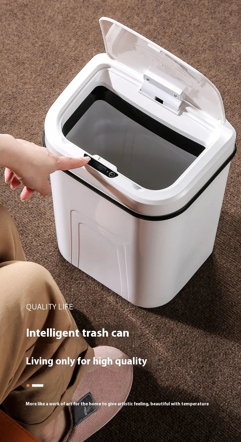 A white intelligent trash can with a lid is shown being opened by a hand on a brown carpet.