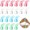 A set of pink, white, and green space-saving hanger connector hooks for closet organization.