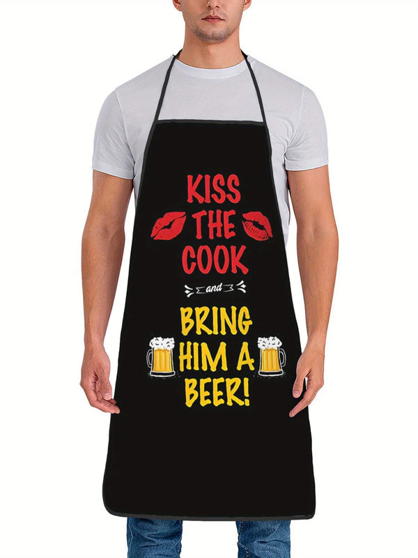 A man wearing a black apron with text that reads Kiss the Cook and Bring him a Beer