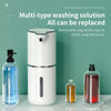 Dispensa automática recargable de jabón blanca con botellas de jabón de reemplazo en una encimera.