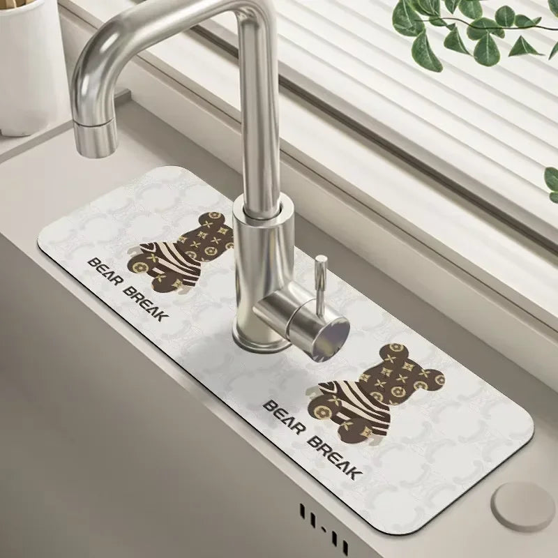 A silver faucet mounted on a white mat with a bear break design in a kitchen sink