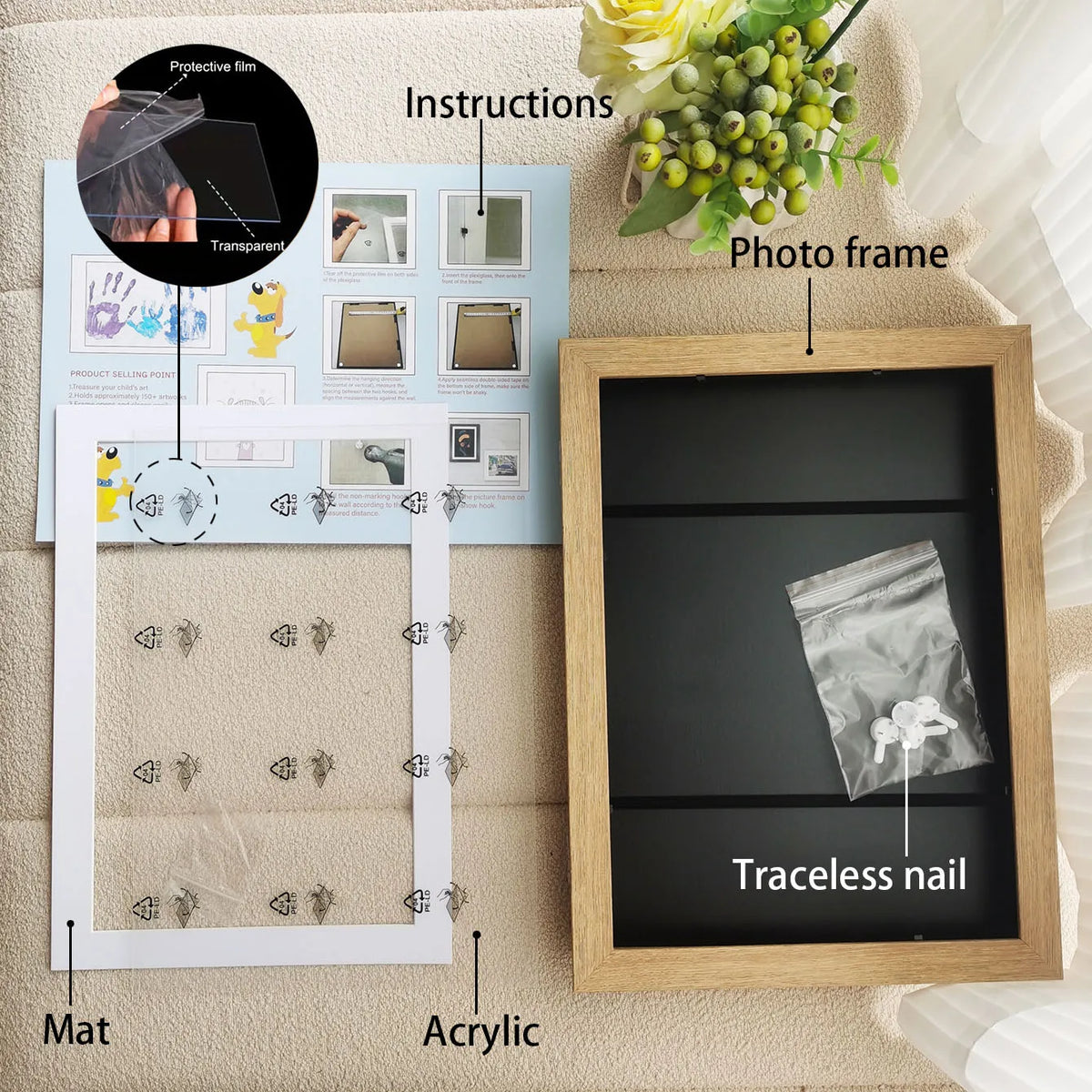 A wooden photo frame displaying a traceless nail, instructions, and a protective film on a mat.