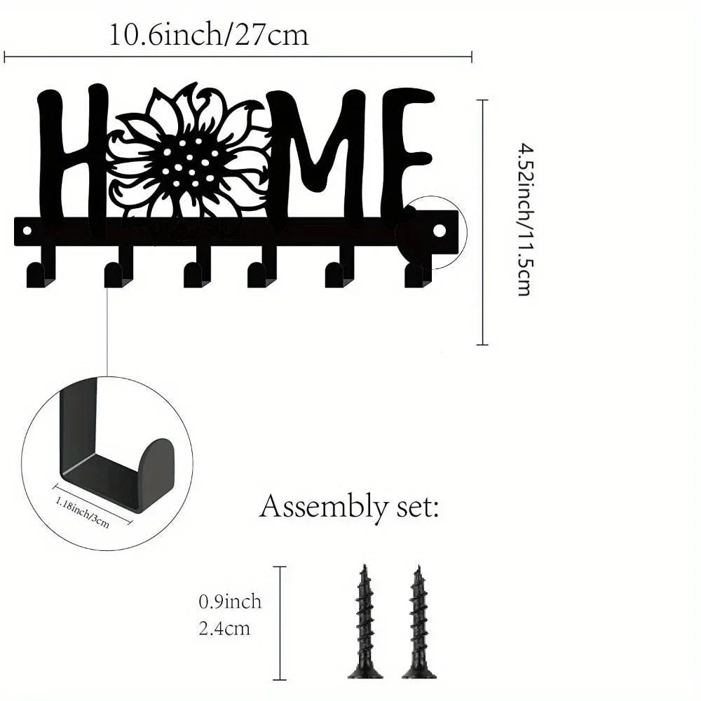 Black rustic iron key holder wall art with a decorative flower design and assembly set.