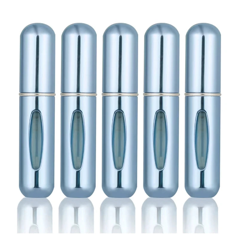 A row of five silver-blue portable refillable perfume spray bottles shown from the side.