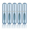 A row of five silver-blue portable refillable perfume spray bottles shown from the side.