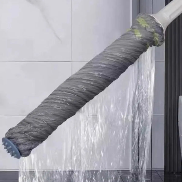 A gray, flexible mop with a coiled handle is shown wringing water in a vertical stream.