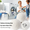 A woman and a child are using reusable wool dryer balls to reduce drying time in a laundry context.
