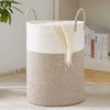 Large woven storage hamper in cream and beige tones with natural fiber handles