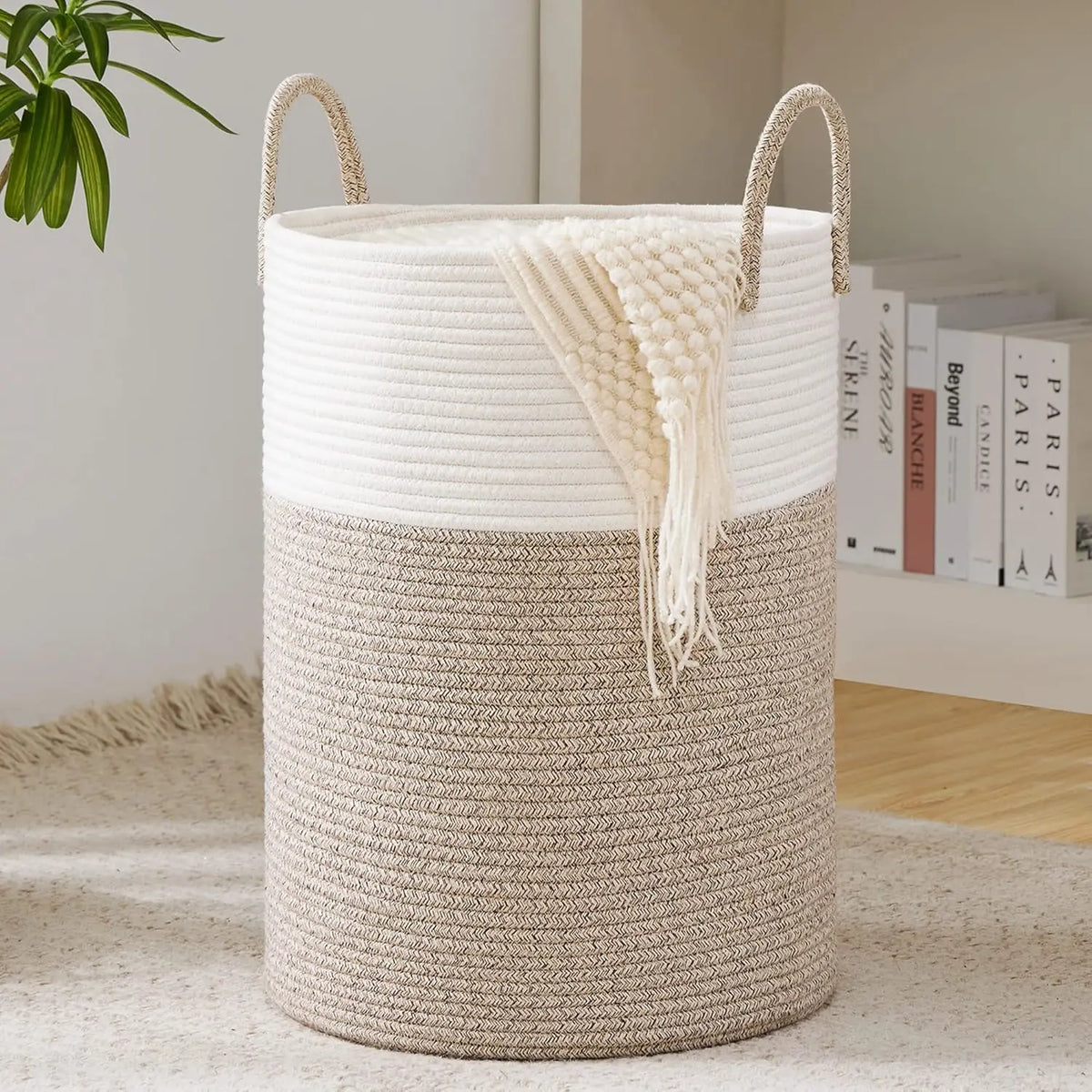Large woven storage hamper in cream and beige tones with natural fiber handles
