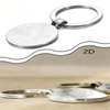 Silver 2D keychain featuring a circular, textured disc and a metal ring.