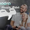 A family is using a white ultra-slim dual nozzle bidet attachment on a toilet.