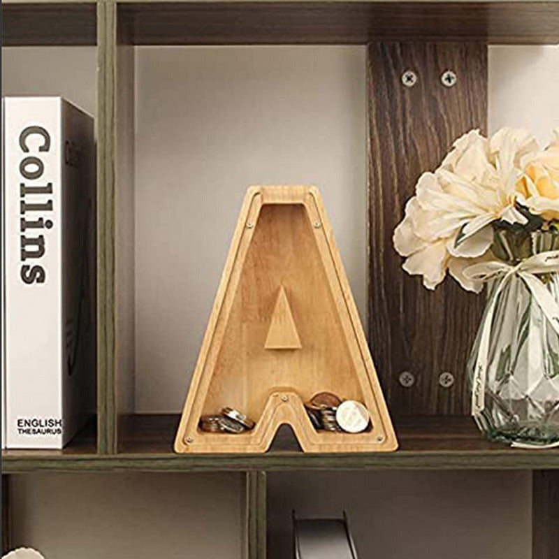 Piggy bank alphabet shaped like the letter A, made of wood, displayed on a shelf.