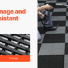 A person sprays water onto a black interlocking drainage mat installed on a tiled floor.
